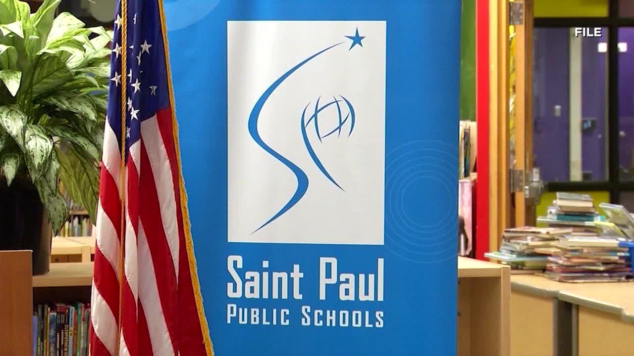 St. Paul school board meeting with members discussing teacher layoffs.