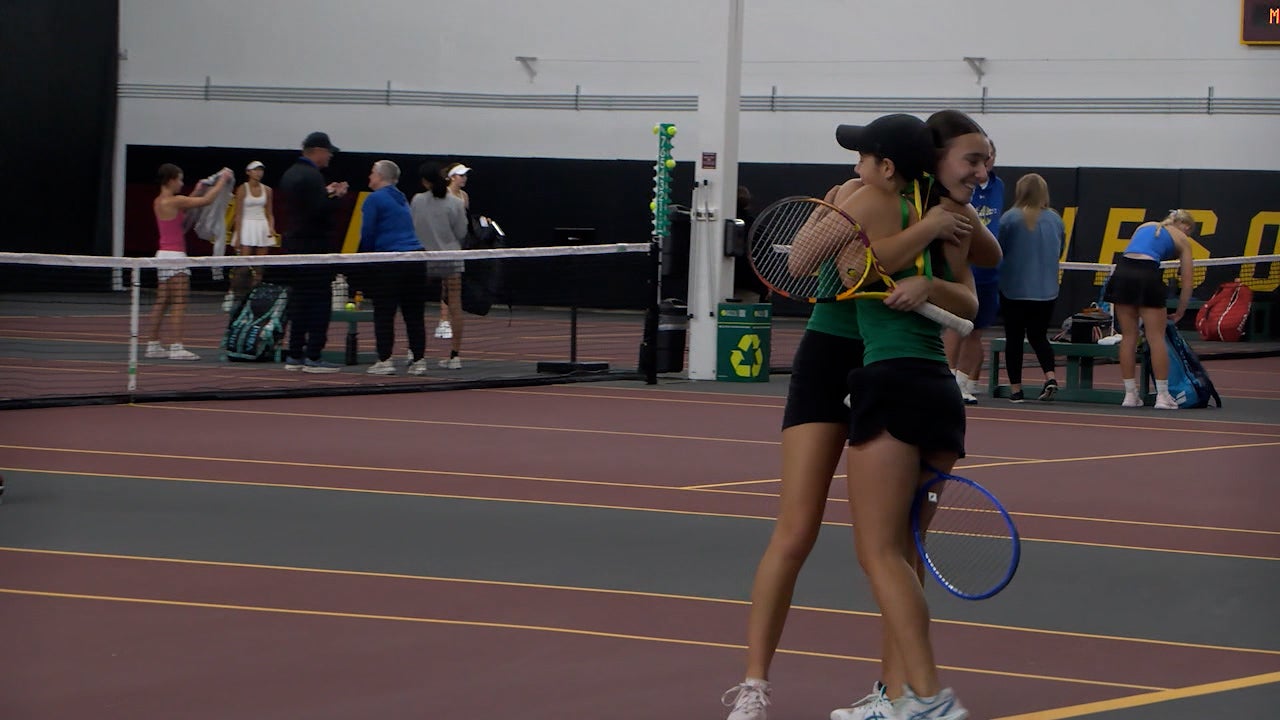 Rochester Mayo girls tennis team celebrating their state championship victory.